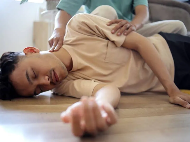 man-doing-cpr-first-aid-checking-pulse-to-asian-g-2025-03-18-11-55-35-utc