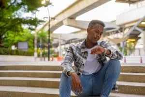 man sitting on stairs outdoor