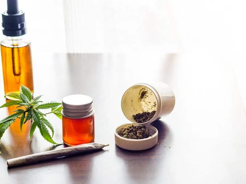cbd-cannabis-oils-weed-and-joint-on-tabletop-medic-2025-01-08-14-23-32-utc
