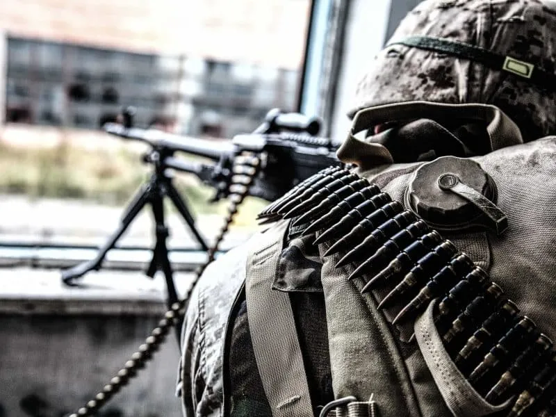commando soldier holding a machine gun