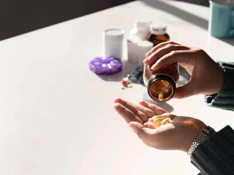 woman taking medications