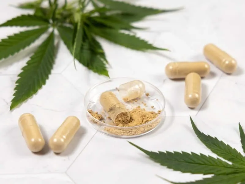 capsules together with cannabis leaf
