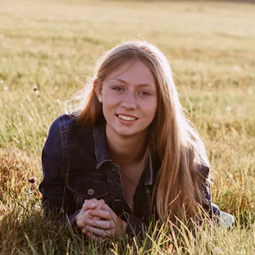 Headshot of Reagan DeBall, smiling