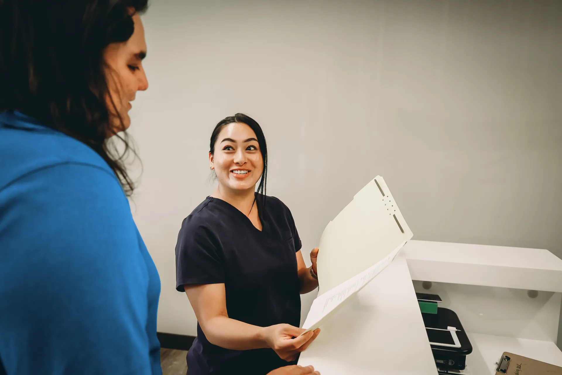 Nurse discussing chart with patient