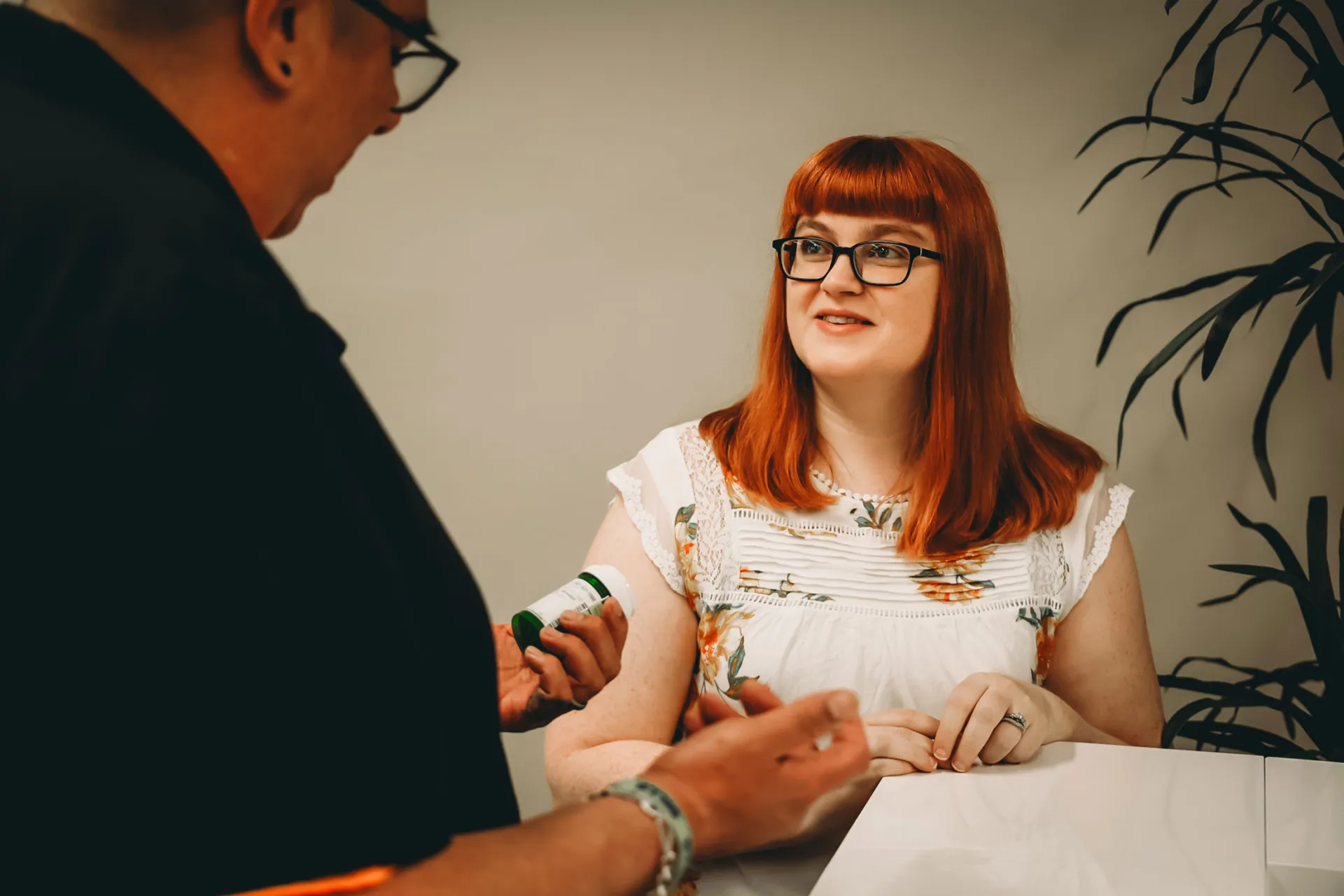 pharmacist explaining medication to patient